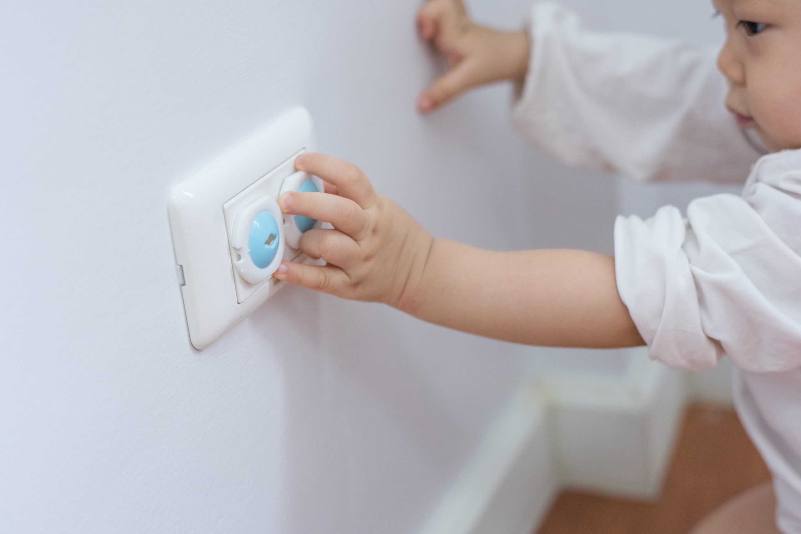 baby touching outlet