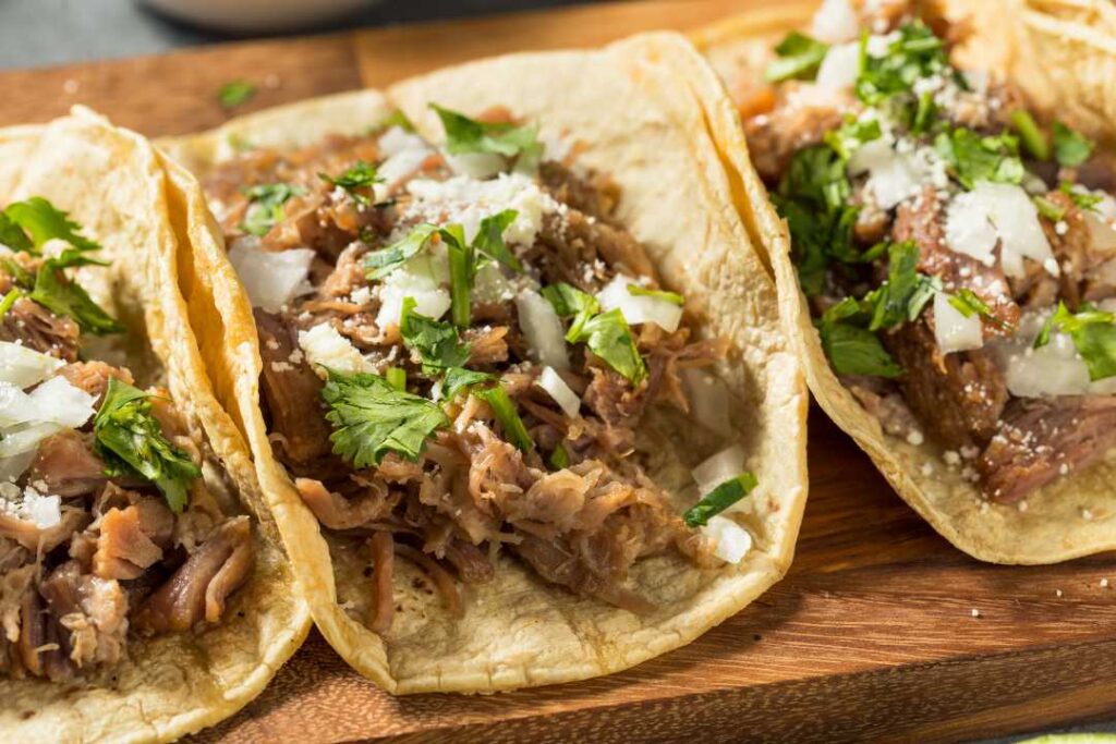 Three carnitas tacos