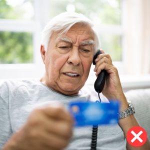 Elderly man repeating credit card information to caller on phone